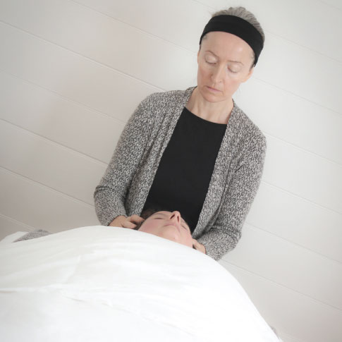 female giving facial Rejuvenation massage